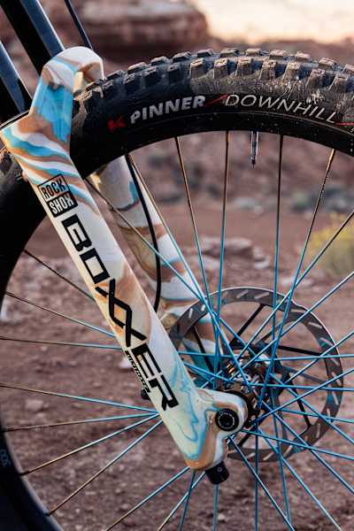 Harriet Burbidge-Smith's bike's front forks, brakes and wheel at Red Bull Rampage 2025.