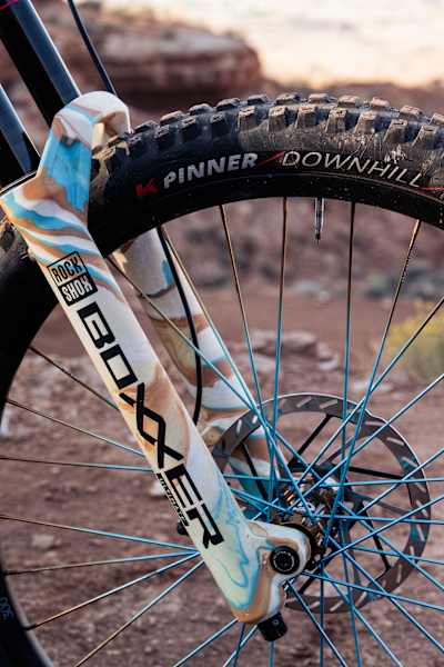 Harriet Burbidge-Smith's bike's front forks, brakes and wheel at Red Bull Rampage 2025.