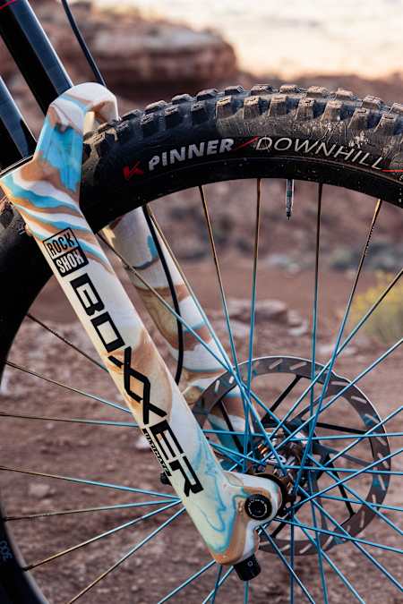 Harriet Burbidge-Smith's bike's front forks, brakes and wheel at Red Bull Rampage 2025.