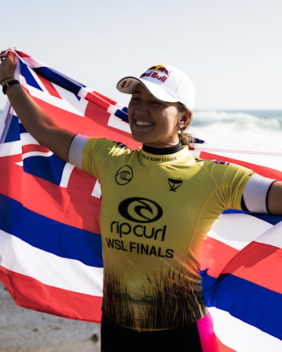 Hawaiian superstar Carissa Moore celebrates winning world title number five on the beach in California