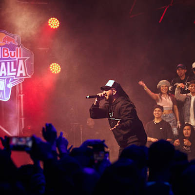 Blackcode electrifies the crowd during his dynamic performance at the Red Bull Batalla National Final in Lima, Peru, on 13 September 2025 as fans cheer him on under vibrant stage lights