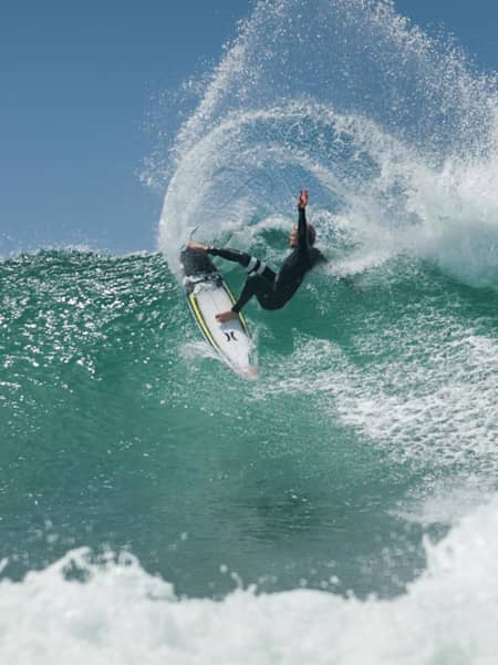 Kolohe Andino does a layback manoeuvre while surfing at Lower Trestles in California.