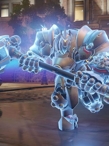 A screenshot of the Ana and Reinhardt characters from the Overwatch video game battling