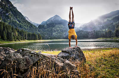 Alexander Megos does a handstand in front of Lake Voralpsee in Switzerland.