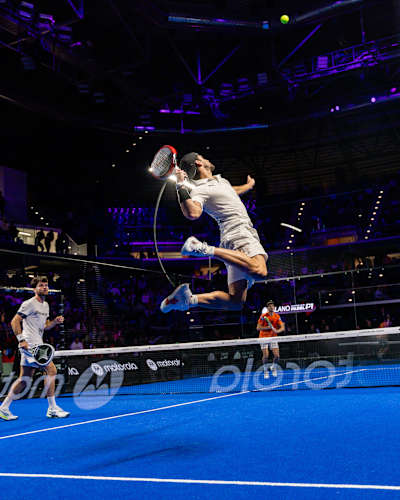 Stretching for a high shot during the Premier Padel tour