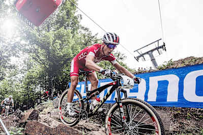 Nino Schurter negotiates Mont-Sainte-Anne's famous technical XCO track.