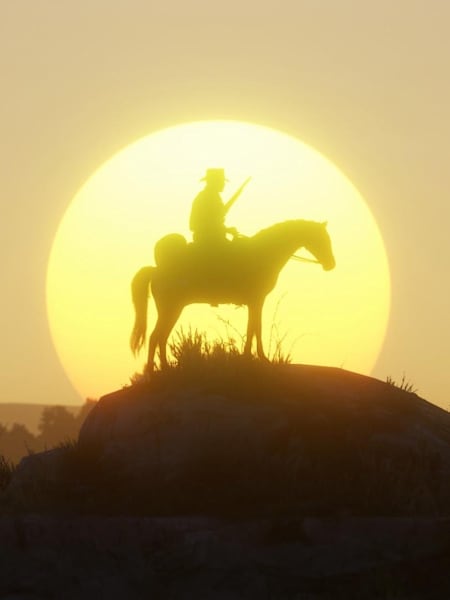 Arthur Morgan and horse are silhouetted against the sun in a scene from Red Dead Redemption 2.
