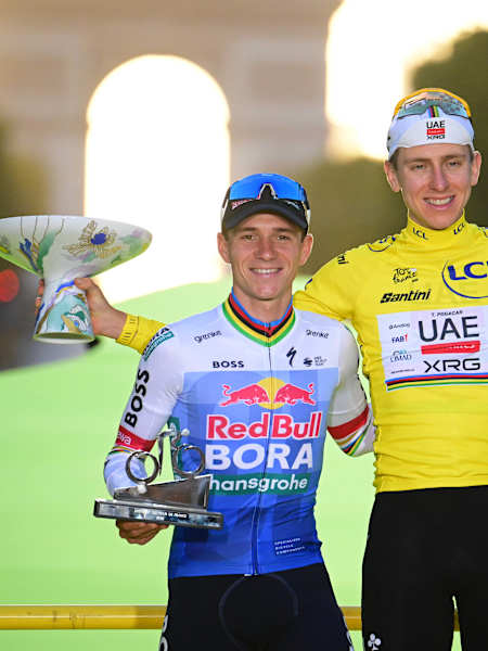 Remco Evenepoel on the podium at the Tour de France in Paris