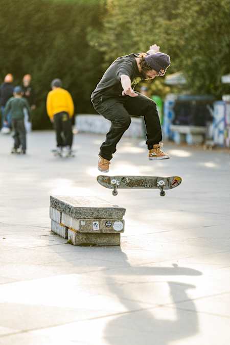 Torey Pudwill performs a nollie backside heelflip crooked grind in Prague