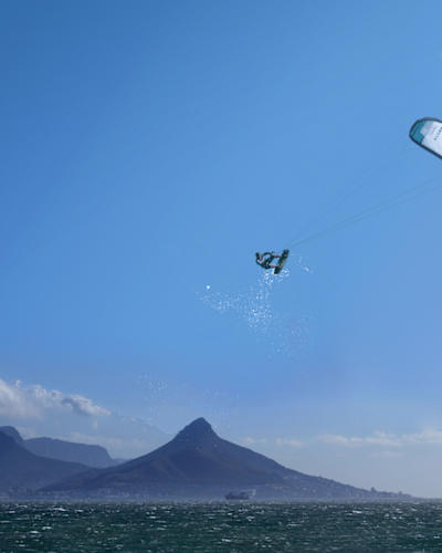 Kiteboarder airtime at Red Bull King of the Air in South Africa Cape Town beach.