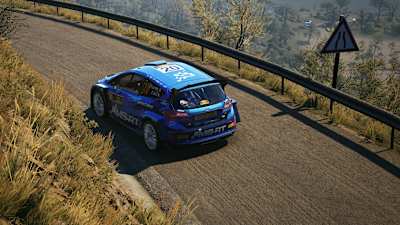 Screenshot from EA Sports WRC shows Adrien Fourmaux's Ford Fiesta on a narrow mountain road