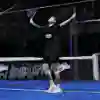 Agustin Tapia raises his arms in triumph during the semi-finals of the Buenos Aires Premier Padel P1 in Argentina, showing Red Bull's competitive spirit in June 2025
