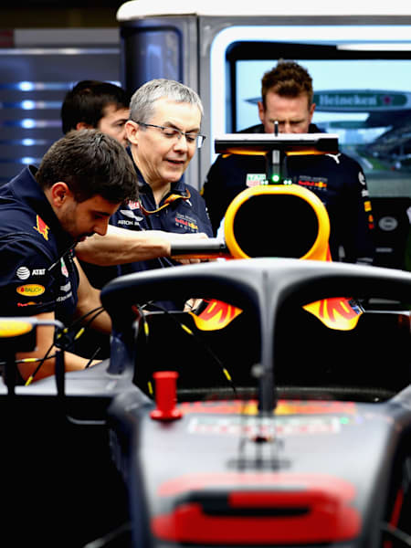 A photo of the Red Bull Racing engineering team working on Daniel Ricciardo's car at the 2018 Formula One Grand Prix of China at Shanghai International Circuit.
