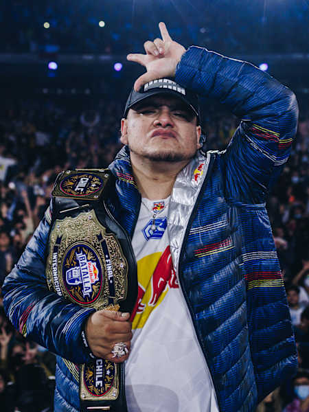 An image of Mexican rapper Aczino with the winner's belt of Red Bull Batalla 2021 in Vina Del Mar, Chile.