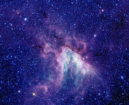 Swan Nebula seen through the Spitzer Space Telescope.