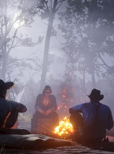Screenshot aus Red Dead Redemption 2 zeigit die Gang am Lagerfreuer. Wir stellen euch die besten Mods für das Game vor.