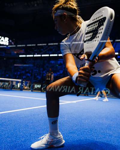 Beatriz González in action on the blue courts of Madrid at the 2025 Comunidad de Madrid Premier Padel P1 final, showcasing her dynamic play and Red Bull energy