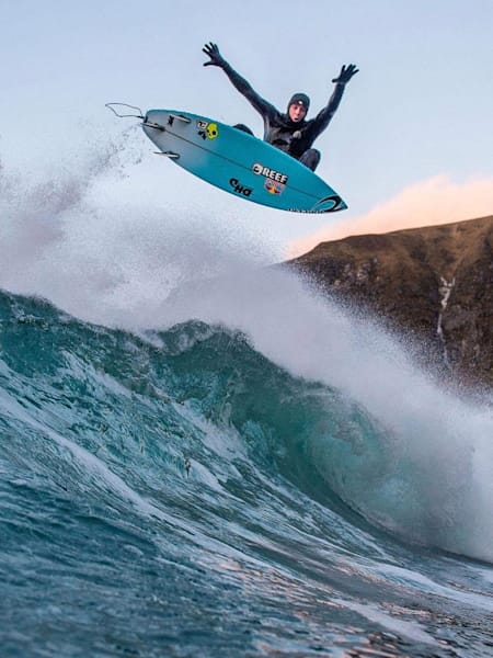 Surfer Mick Fanning performs an aerial in Norway.