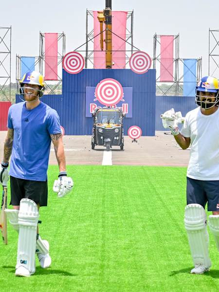 Ben Stokes and KL Rahul smiling while on a unusual field at the Red Bull Ultimate Cricket Challenge
