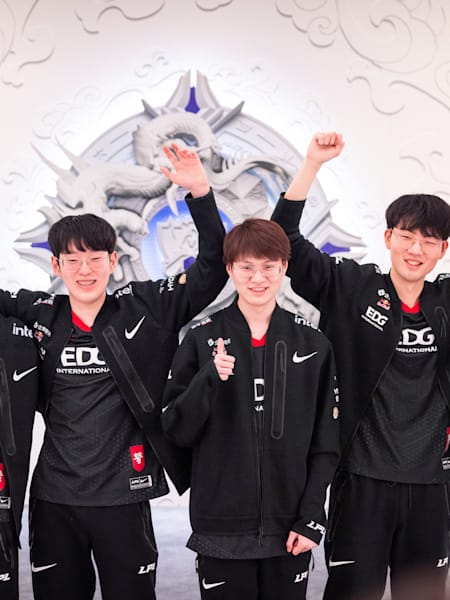 Edward Gaming celebrate their win at the League of Legends World Championships 2021 quarter-final.