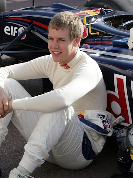 Sebastian Vettel sitting next to his WSR car.