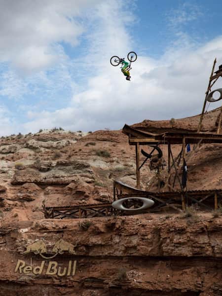 Mountain biker Cam Zink throws a backflip off the Oakley Icon Sender at Red Bull Rampage 2013