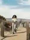 Singer Danitsa walks an a boardwalk in LA, California.
