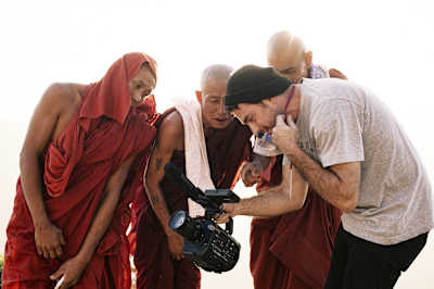 Sebastien Abes showing Monks his footage, during the filming of the project ,Myanmar-The Golden Skate Odyssey', Yangon, Myanmar, January 19, 2016.