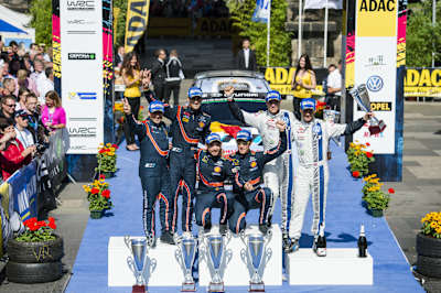 Thierry Neuville (1), Dani Sordo (2), Andreas Mikkelsen (3) celebrate after the FIA World Rally Championship 2014 in Trier, Germany on August 24, 2014.
