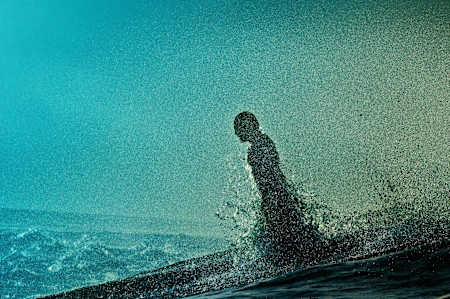 Chris Kalima launches through a wave