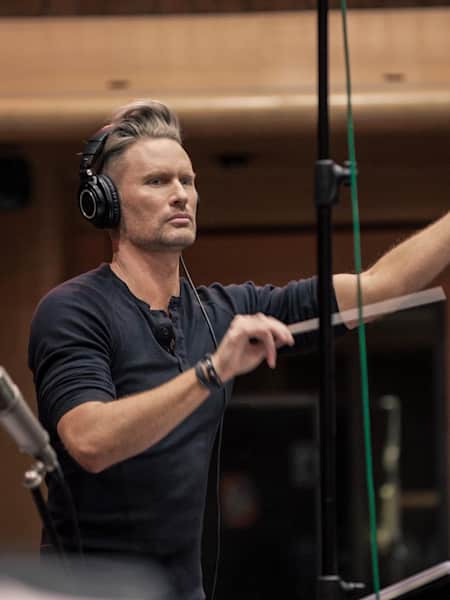 An image of composer Brian Tyler in the studio.