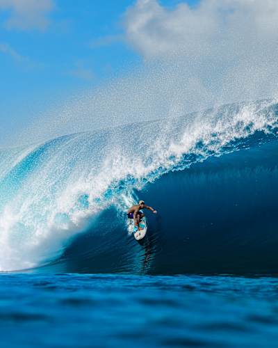 Kauli Vaast charges through a perfect tube at Teahupoo, Tahiti during a Red Bull surfing event on May 1, 2025, showcasing epic wave-riding and unmatched athleticism
