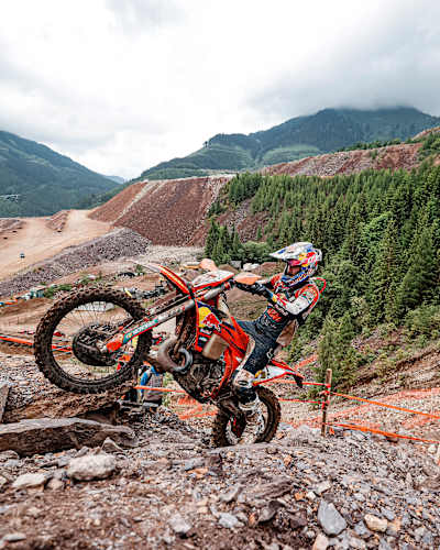 A rider is seen battling his way uphill at the 2025 edition of Red Bull Erzbergrodeo. 