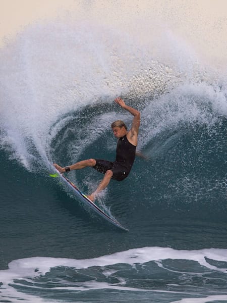Professional surfer Kolohe Andino does a frontside gouge on a small right on the North Shore of Oahu Hawaii during the winter 2017 season.