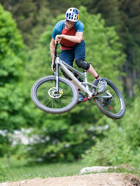 Mountain biker Thomas Oehler performing a whip