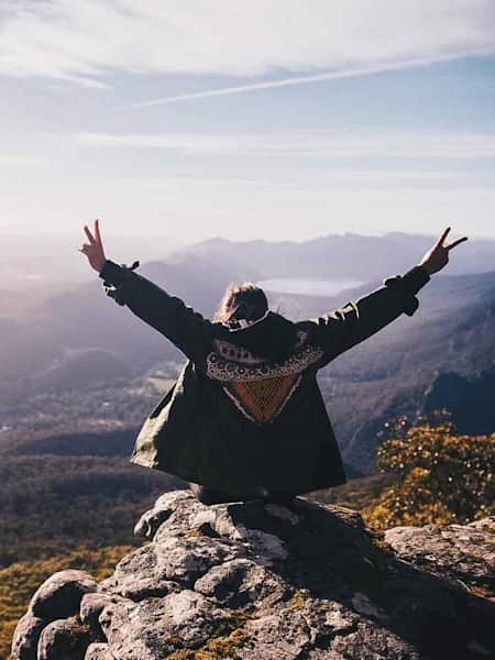 Girl sitting on top of the Grampians in Victoria