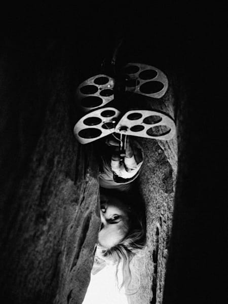 Pamela Shanti Pack at Indian Creek, Utah, United States. Seen through a rock crack by Jeremiah Watt for Red Bull Illume 2016.