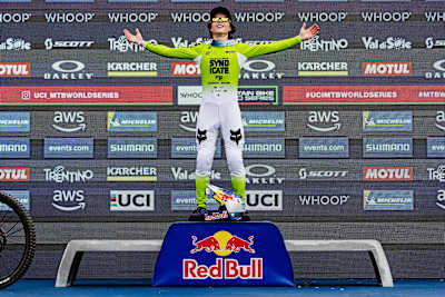 Jackson Goldstone stands triumphant atop the podium at the UCI Mountain Bike World Cup in Val di Sole, Italy, on June 20, 2025.