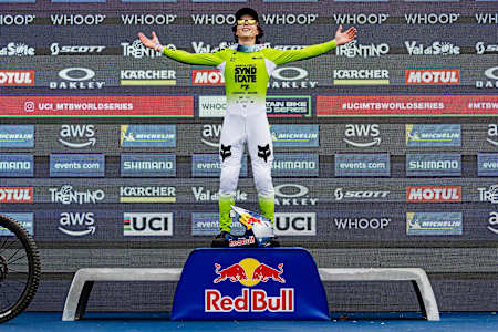 Jackson Goldstone stands triumphant atop the podium at the UCI Mountain Bike World Cup in Val di Sole, Italy, on June 20, 2025.