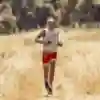 Ryan Sandes running in a field
