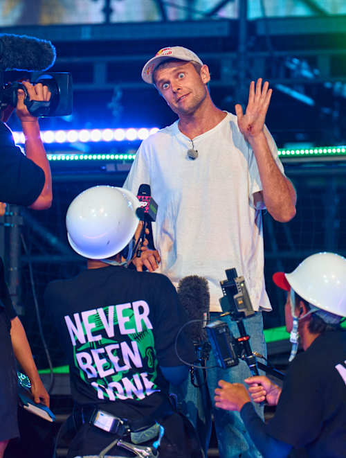 Madars Apse stands with the Red Bull production team at Kasso 2024 in Yokohama-shi, capturing the dynamic atmosphere of this exciting event