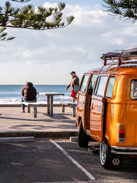 Camper van next to an Australian beach