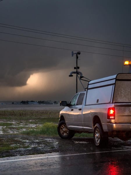 Scientists in a research vehicle observe a tornado near Dodge City, Kansas, May 24, 2016.
