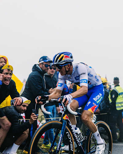 Florian Lipowitz representing Red Bull - BORA - hansgrohe conquers Stage 18 at Courchevel Col de la Loze during the Tour de France 2025.