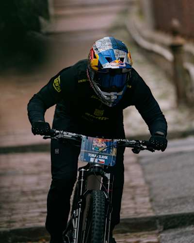 Tomáš Slavík rides with intensity at the Red Bull Cerro Abajo event in Genova, Italy, near Teatro Nazionale Genova on August 24th, 2025, showcasing thrilling downhill mountain biking action