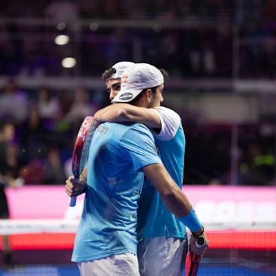 Players celebrate on the court at a Premier Padel event.