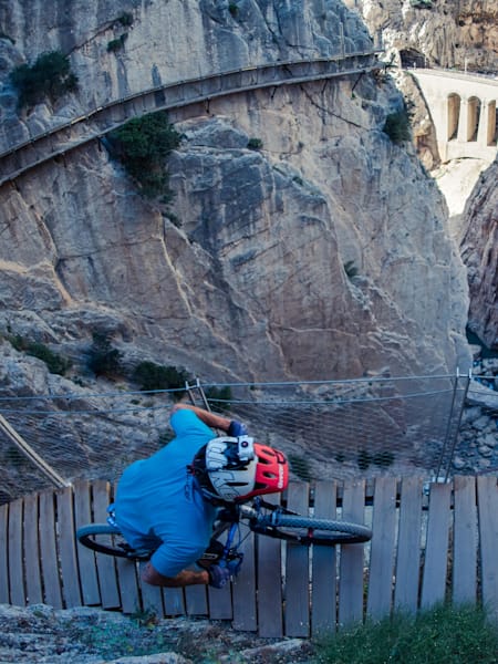 David Cachón rides his MTB on the perilous El Caminito del Rey walkway route near Malaga, Spain