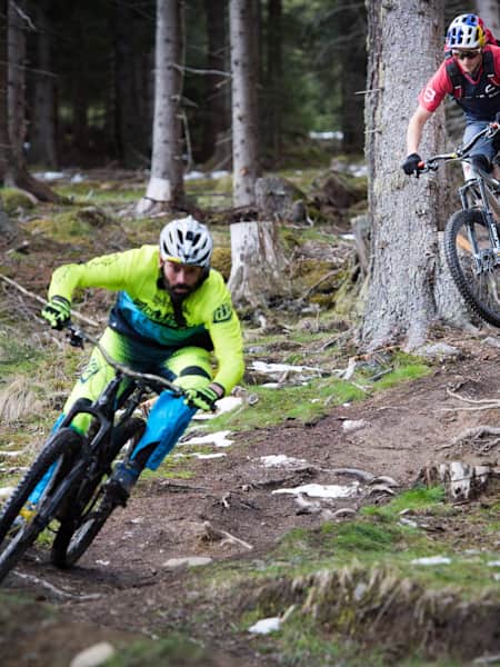 MTB riders Rob Warner and Tom Oehler ride trails in the mountains around Innsbruck, Austria.