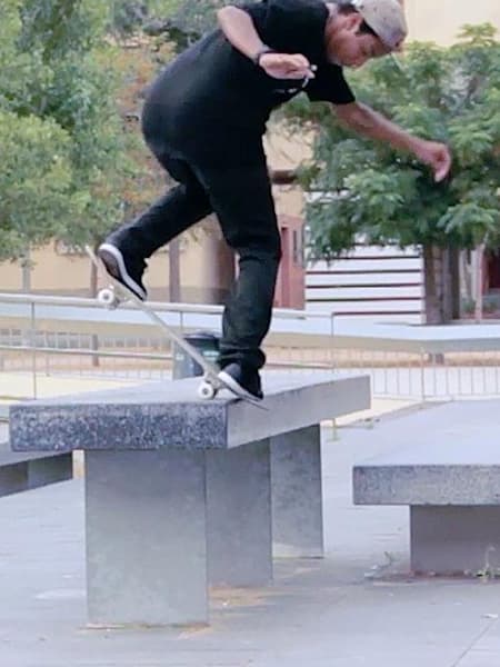 Felipe Gustavo backside nosebluntslides on a bench in Barcelona