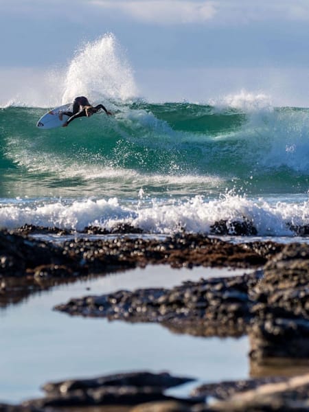 Surfer Caroline Marks performs a turn while surfing at J-Bay in South Africa.